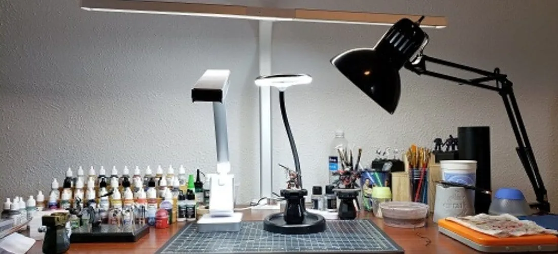 professional miniature painting workspace setup desk lighting reference